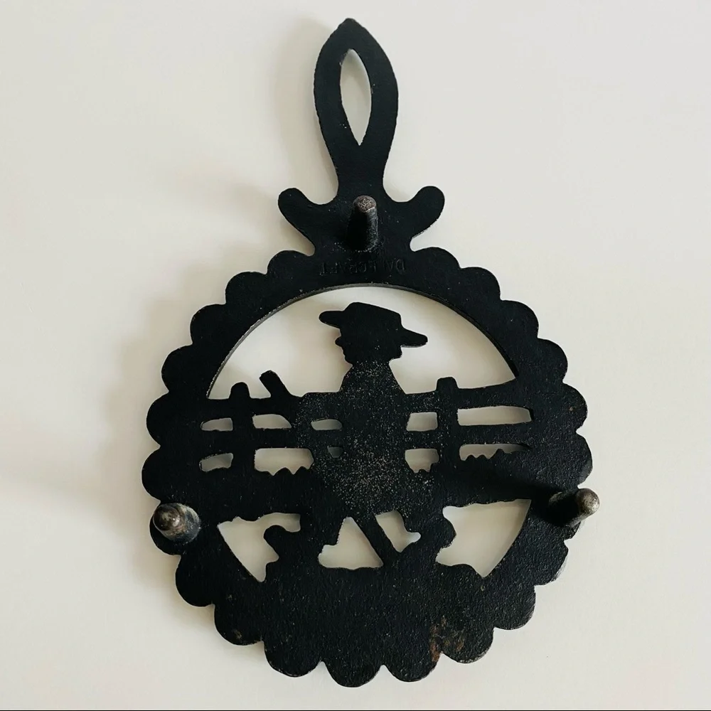Vintage  Cast Iron Amish Woman and  man Trivets.